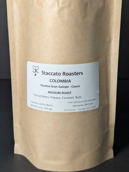 Staccato Roasters Gran Galope Colombia medium roast whole bean coffee, 12 oz bag with caramel, papaya, and nutty tasting notes.