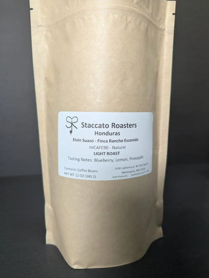 Staccato Roasters Honduras Elvin Suazo Natural whole bean coffee in a 12 oz kraft bag featuring notes of pineapple, subtle blueberry, and sweet finish.
